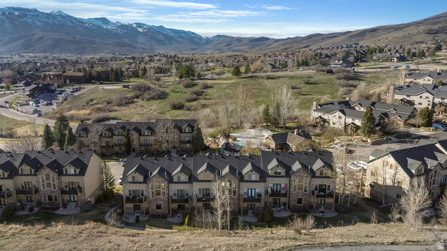 3598 North Huntsman Path, Unit 502 Eden, UT 84310 - Photo 41 of 43 Aerial perspective of suburban area featuring a mountain backdrop