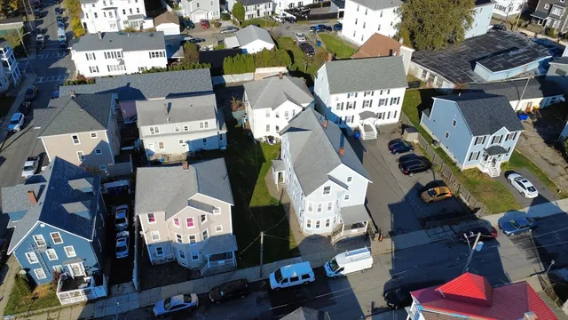 an aerial view of residential houses with outdoor space