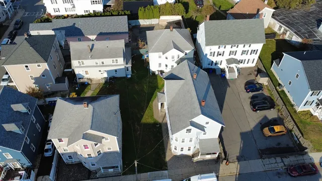 an aerial view of residential houses with outdoor space