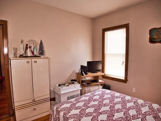 a room with a bed and a window