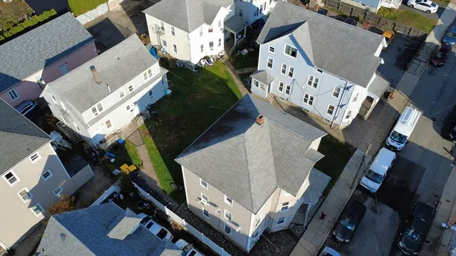 an aerial view of a house with outdoor space