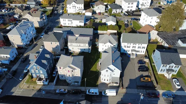 an aerial view of residential houses with outdoor space