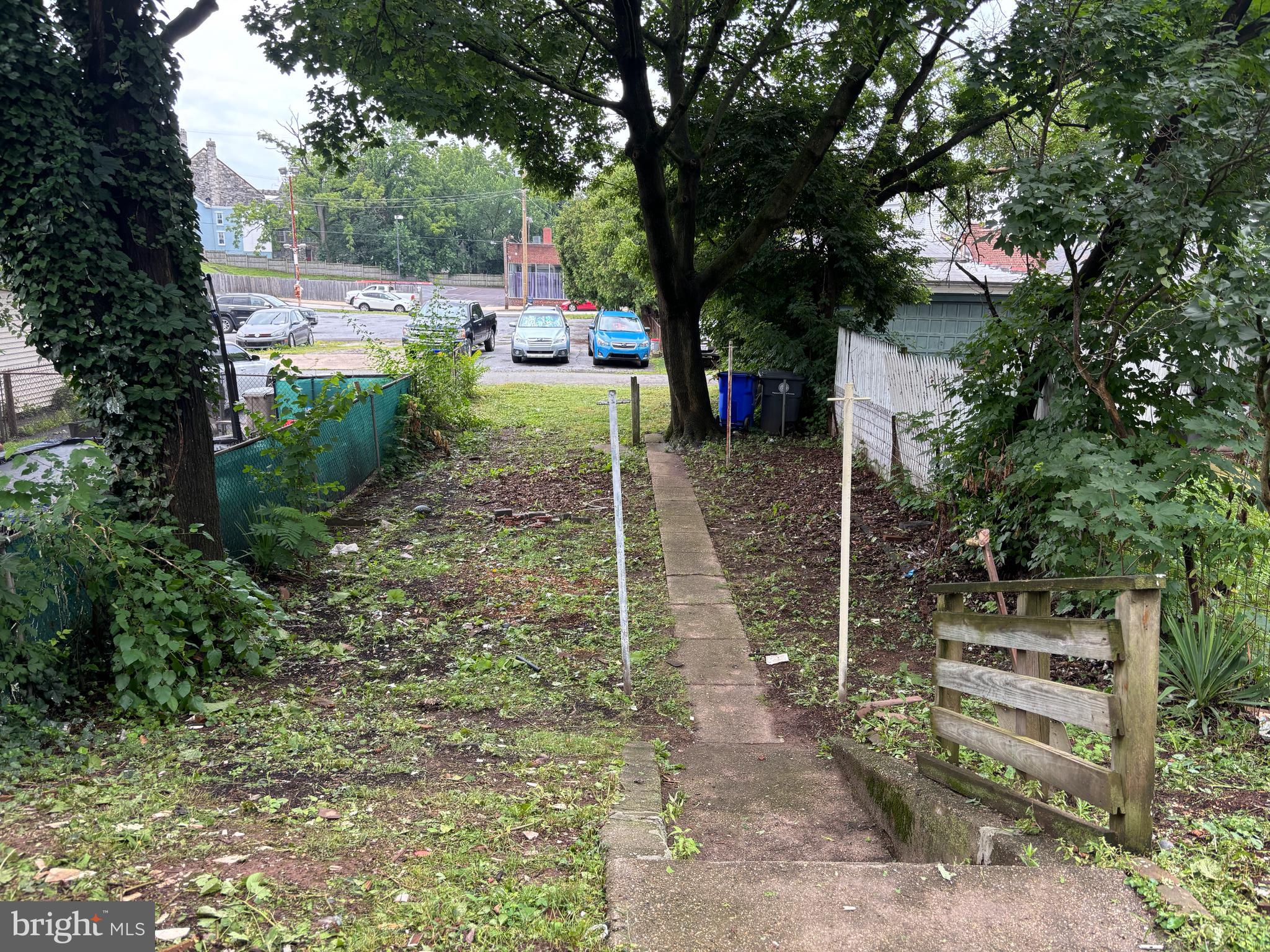 130 East 4th Street, Unit 1 Pottstown, PA 19464 - Photo 2 of 12 a backyard of a house with table and chairs