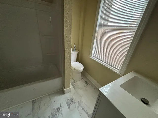 a bathroom with a sink and a vanity
