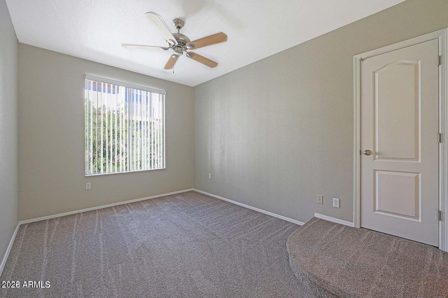 1701 East Colter Street, Unit 11 Phoenix, AZ 85016 - Photo 14 of 31 a view of an empty room with a window