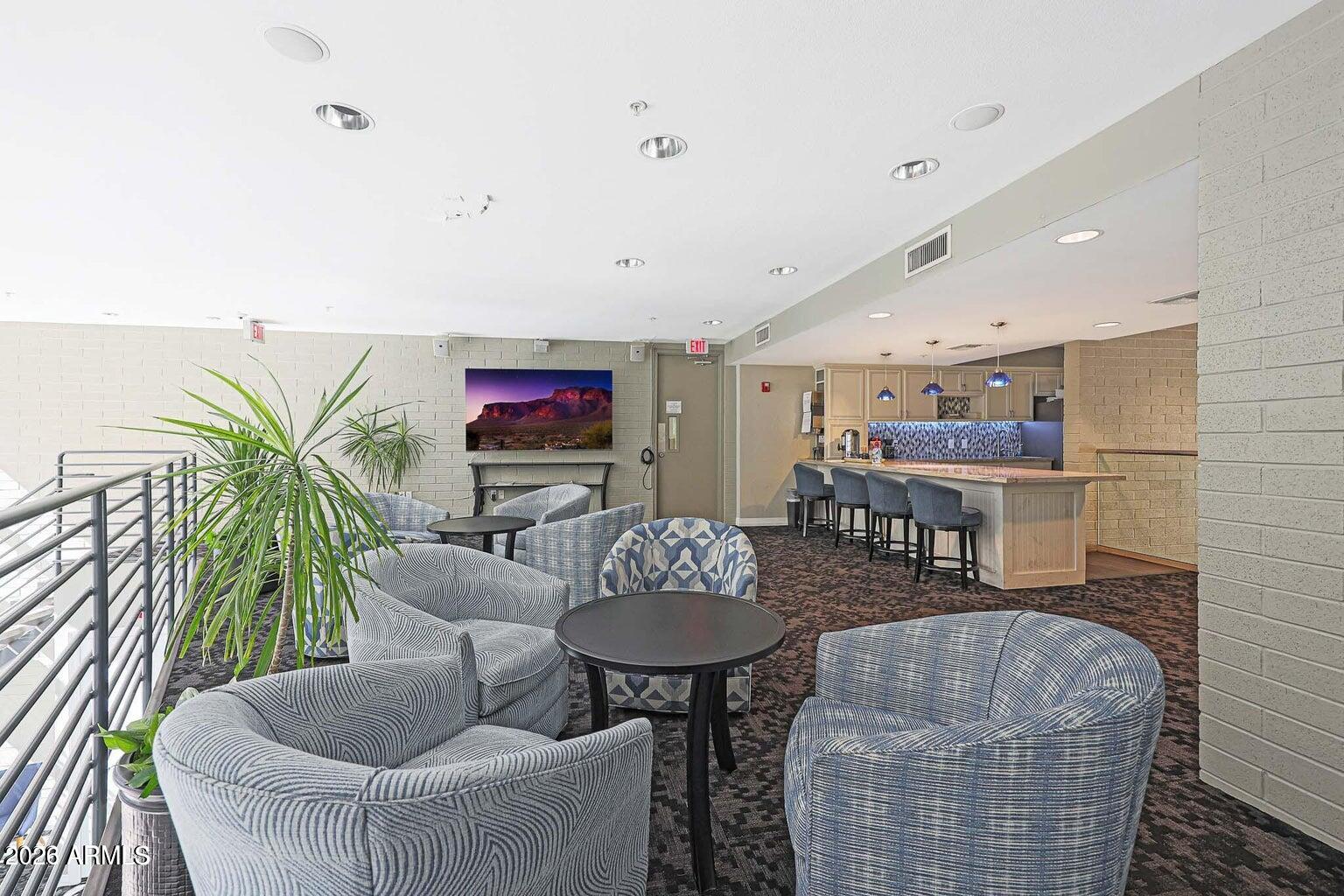 1701 East Colter Street, Unit 11 Phoenix, AZ 85016 - Photo 30 of 31 a living room with furniture and a flat screen tv