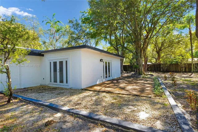 a house with trees in the background