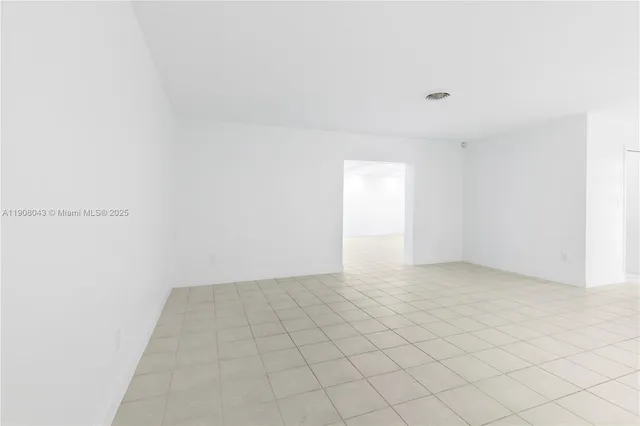 a view of an empty room and window