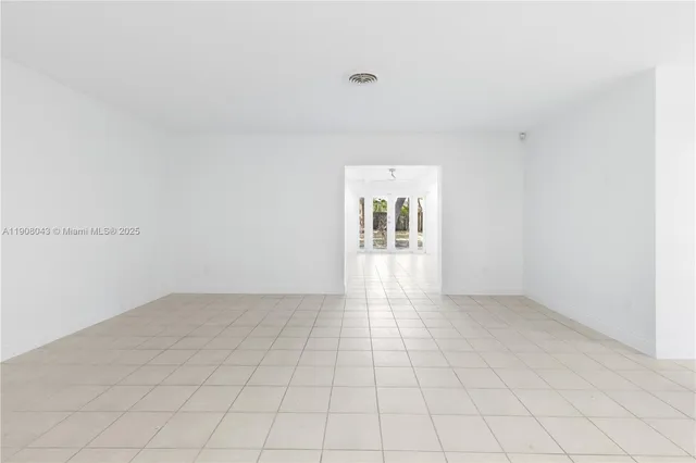 a view of an empty room and window