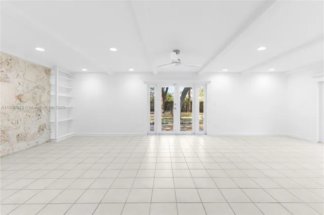 an empty room with glass door