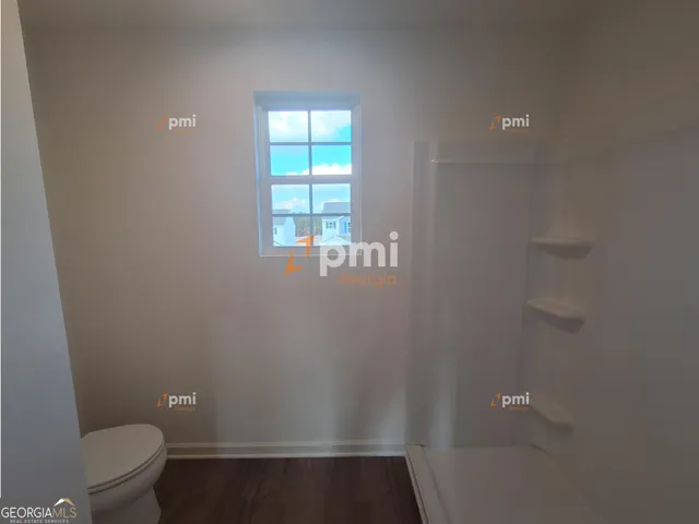 a bathroom with a toilet