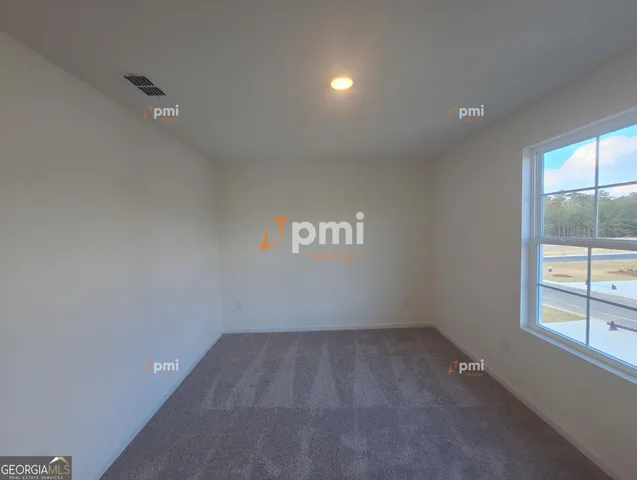 an empty room with a empty space and window