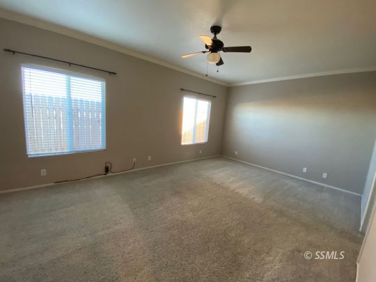 1516 South Farragut Street Ridgecrest, CA 93555 - Photo 16 of 24 a view of an empty room with a window