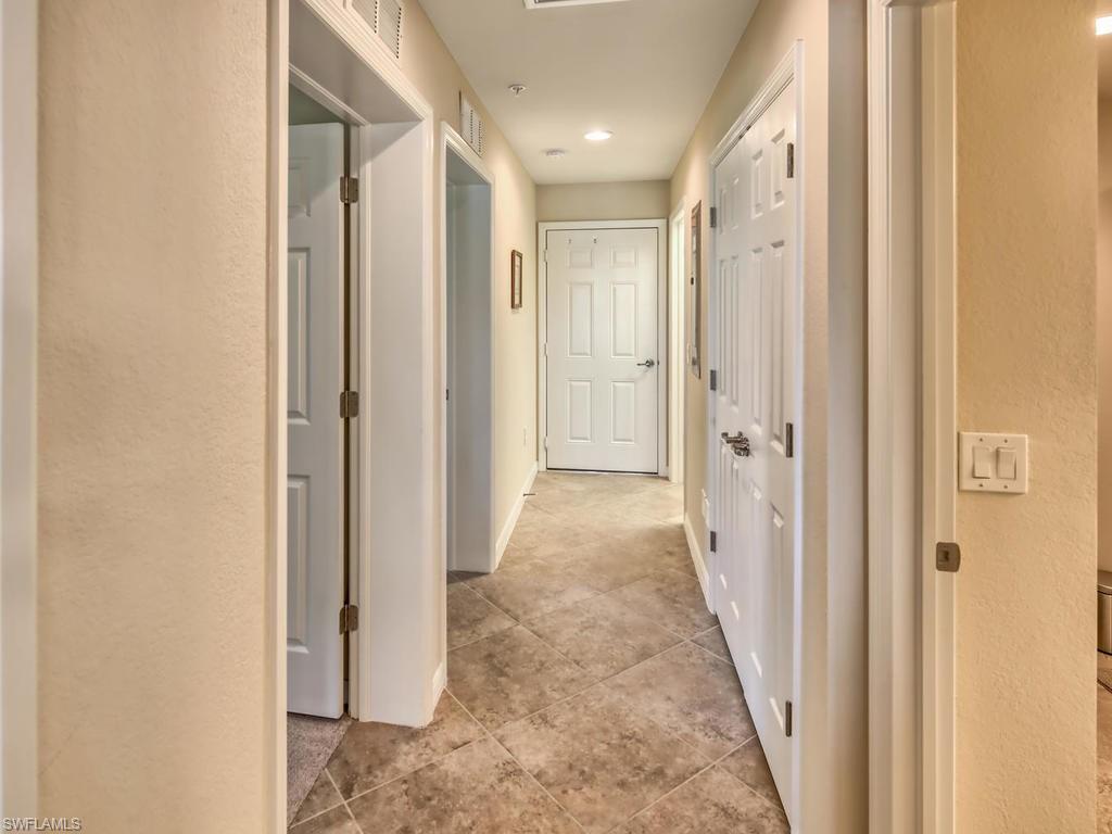 9114 Prima Way, Unit 102 Naples, FL 34113 - Photo 13 of 33 a view of a hallway with a elevator