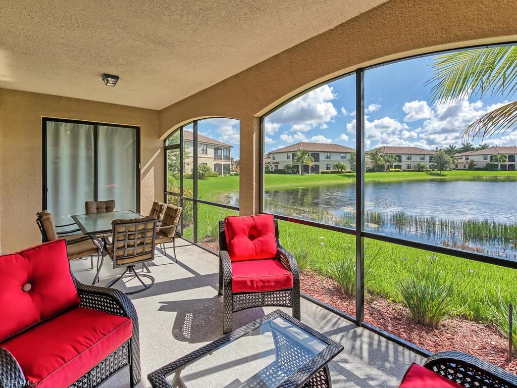 9114 Prima Way, Unit 102 Naples, FL 34113 - Photo 19 of 33 a building outdoor space with patio furniture