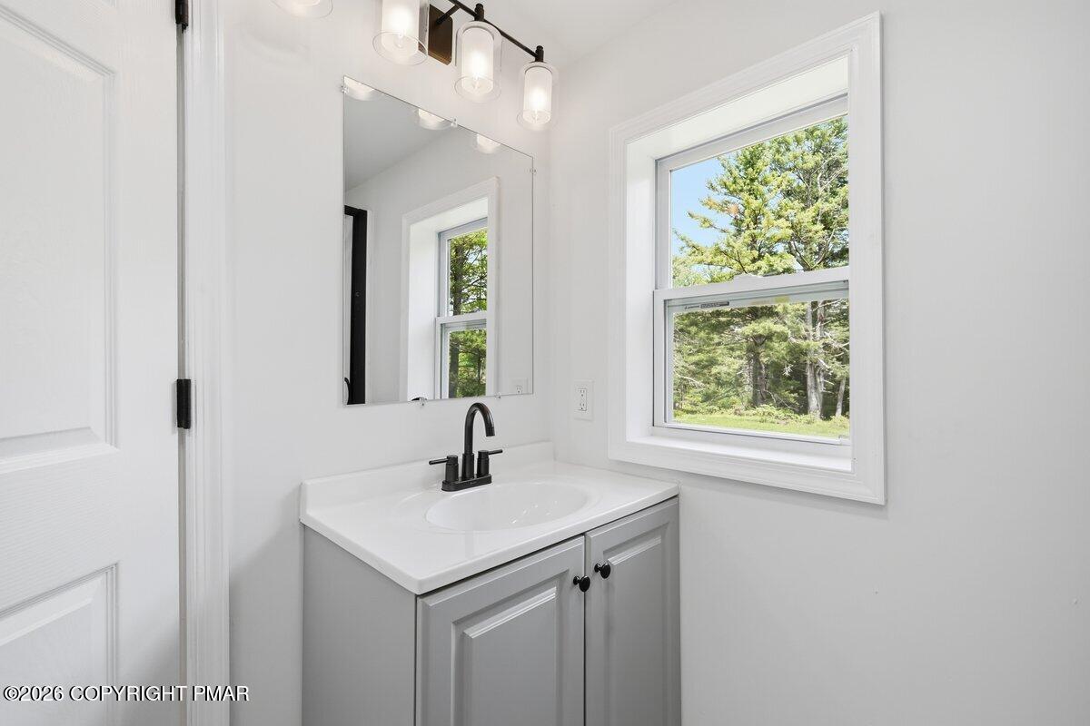155 Blooming Grove Road Hawley, PA 18428 - Photo 28 of 41 a bathroom with a sink and a window