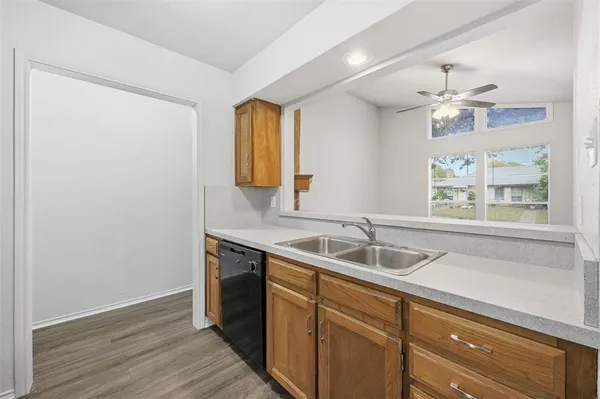 a kitchen with a sink and a window