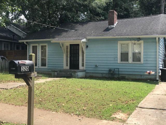 320 Spring Street Decatur, GA 30030 - Photo 1 of 1 a front view of a house with garden