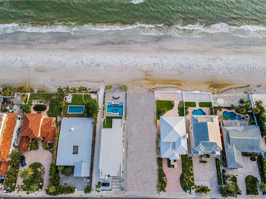 16200 Gulf Boulevard Redington Beach, FL 33708 - Photo 2 of 11 an aerial view of residential houses with outdoor space and parking