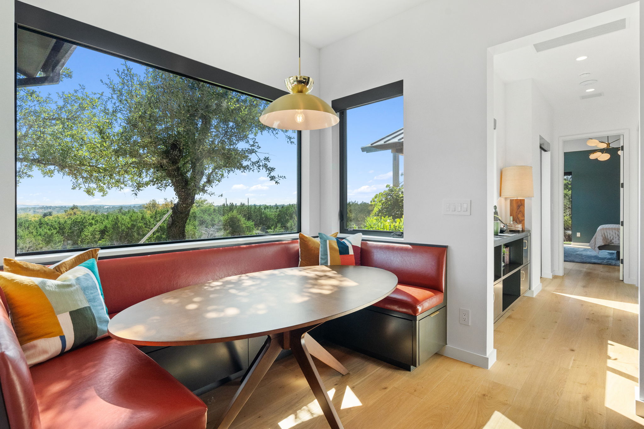 503 Happy Trail Dripping Springs, TX 78620 - Photo 12 of 38 Integrated dining nook featuring built-in banquette seating with a panoramic window