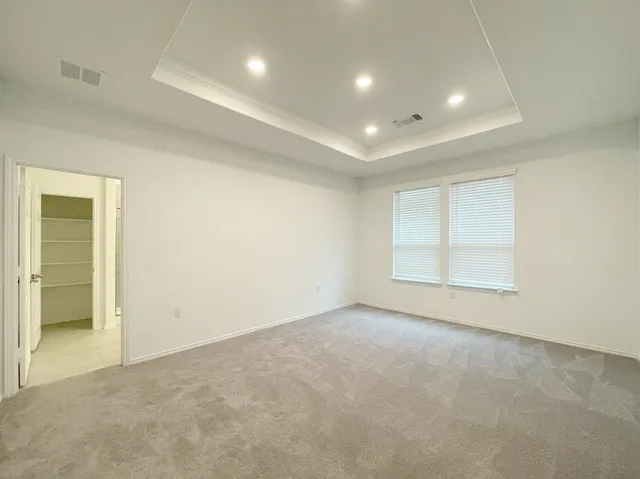 an empty room with a empty space and windows
