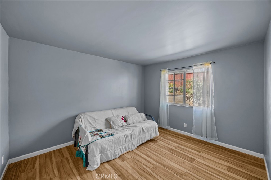 820 Cozy Court Fallbrook, CA 92028 - Photo 25 of 38 a bedroom with a bed and wooden floor