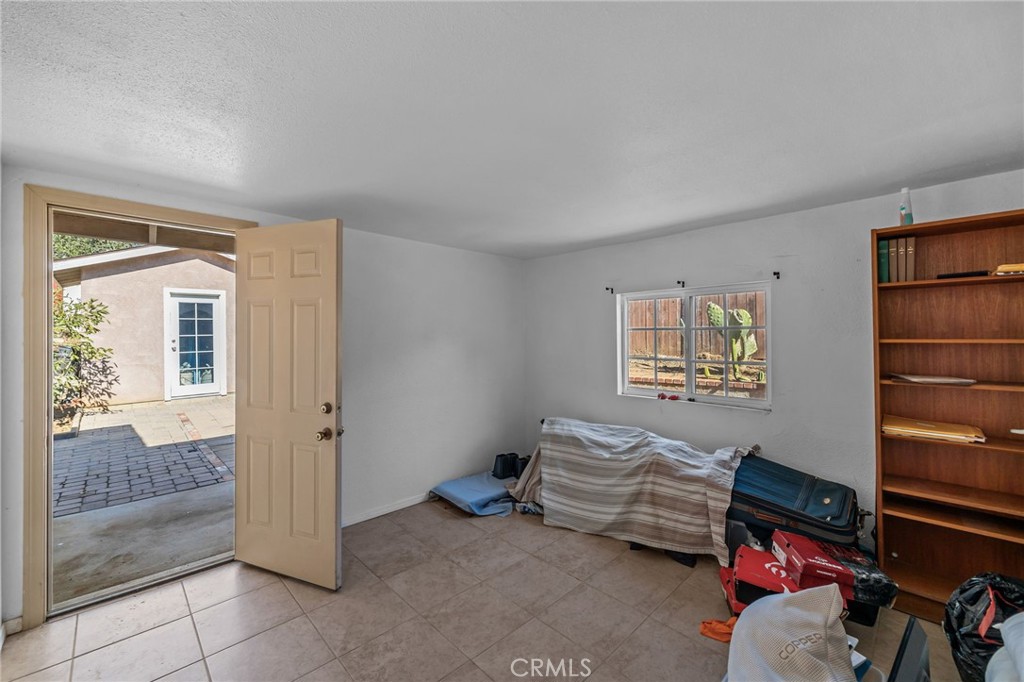 820 Cozy Court Fallbrook, CA 92028 - Photo 28 of 38 a bedroom with furniture and a window