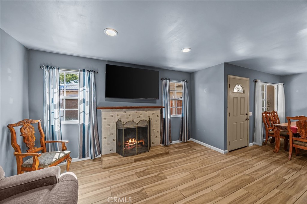 820 Cozy Court Fallbrook, CA 92028 - Photo 7 of 38 a living room with furniture and a fireplace