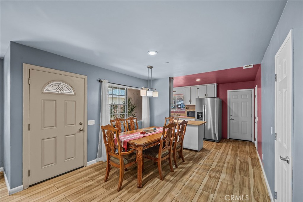 820 Cozy Court Fallbrook, CA 92028 - Photo 9 of 38 a view of a dining room with furniture and wooden floor