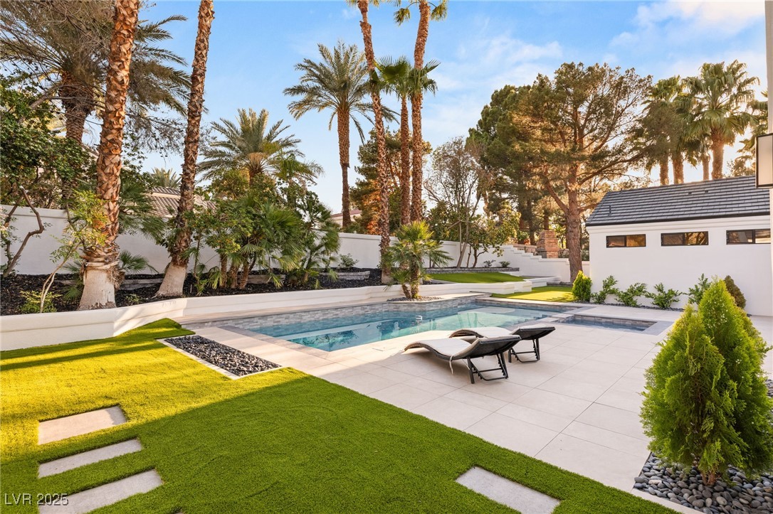 2316 Prometheus Court Henderson, NV 89074 - Photo 55 of 92 View of pool with a fenced in pool, a patio, a fenced backyard, and a lawn