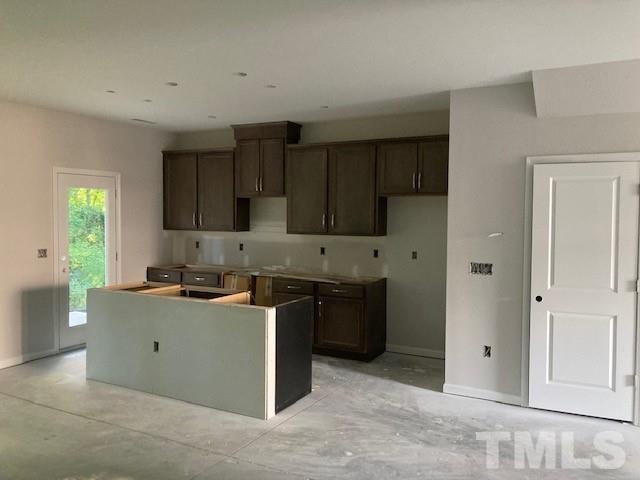 812 Star Rdg Drive Raleigh, NC 27610 - Photo 18 of 23 a kitchen with stainless steel appliances granite countertop a stove a sink and a refrigerator