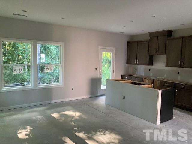 812 Star Rdg Drive Raleigh, NC 27610 - Photo 20 of 23 a kitchen with a stove a sink and a window