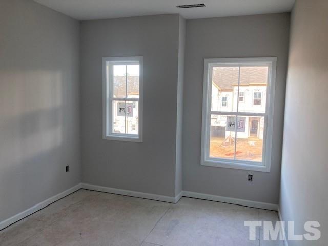 812 Star Rdg Drive Raleigh, NC 27610 - Photo 10 of 23 an empty room with windows