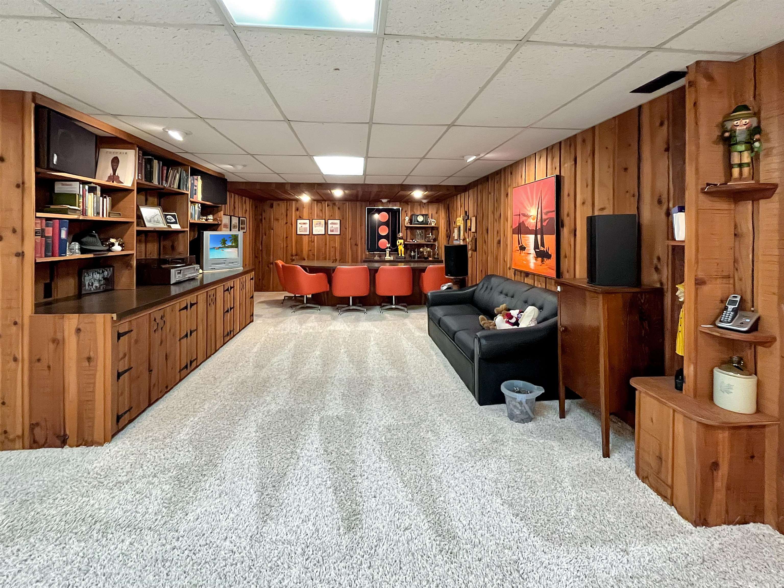 11 East Division Road Shannon, IL 61078 - Photo 19 of 33 a room with lots of furniture and a flat screen tv