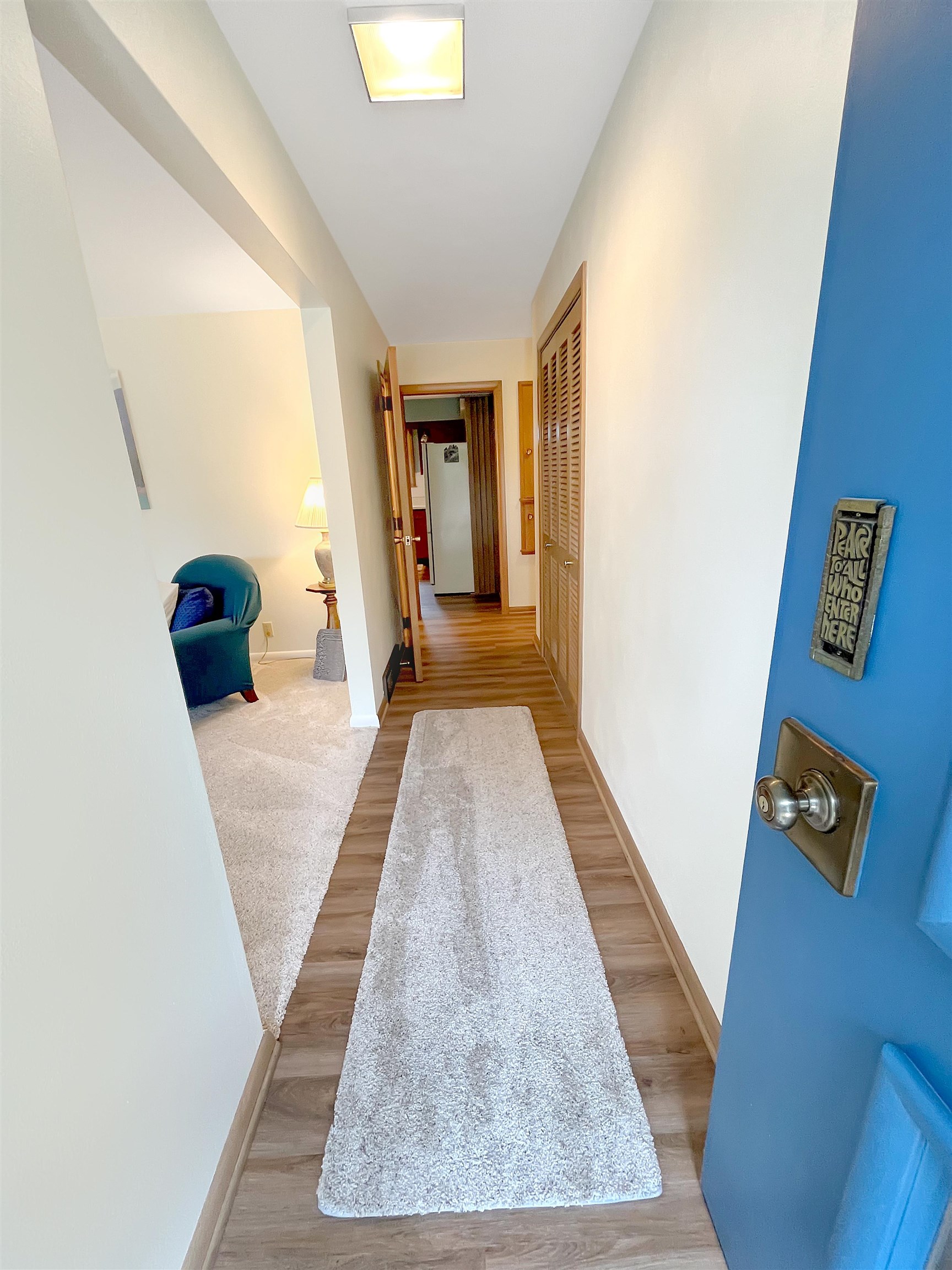 11 East Division Road Shannon, IL 61078 - Photo 3 of 33 a view of a hallway with wooden floor and furniture
