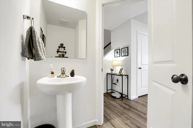 a bathroom with a sink and mirror