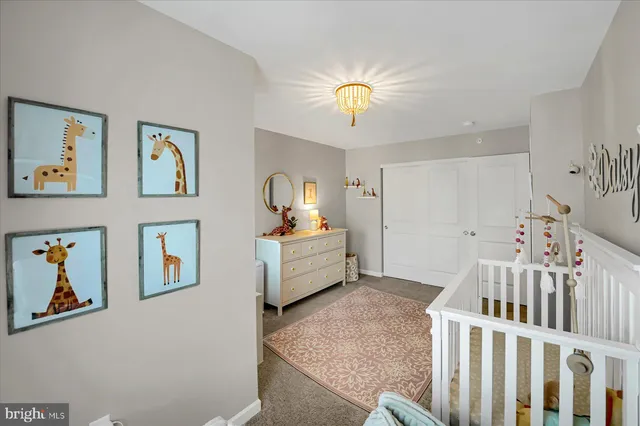 a bedroom with furniture and window