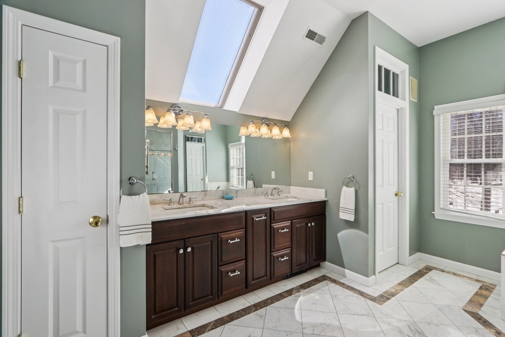11 Thaxton Road Beverly, MA 01915 - Photo 6 of 40 a spacious bathroom with a granite countertop sink mirror and double