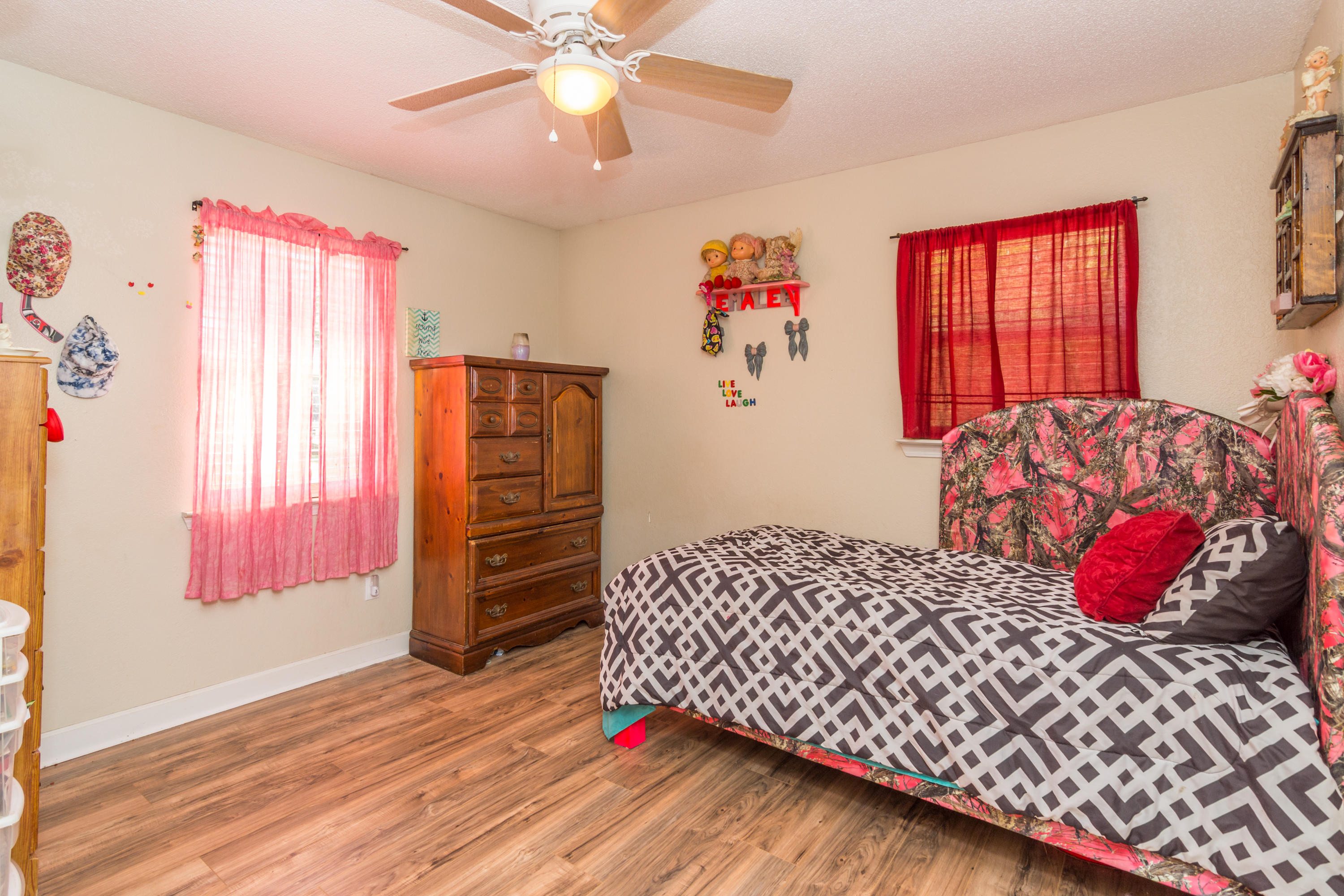 8322 Stokes Road Laurel Hill, FL 32567 - Photo 14 of 25 a bedroom with a bed and a window