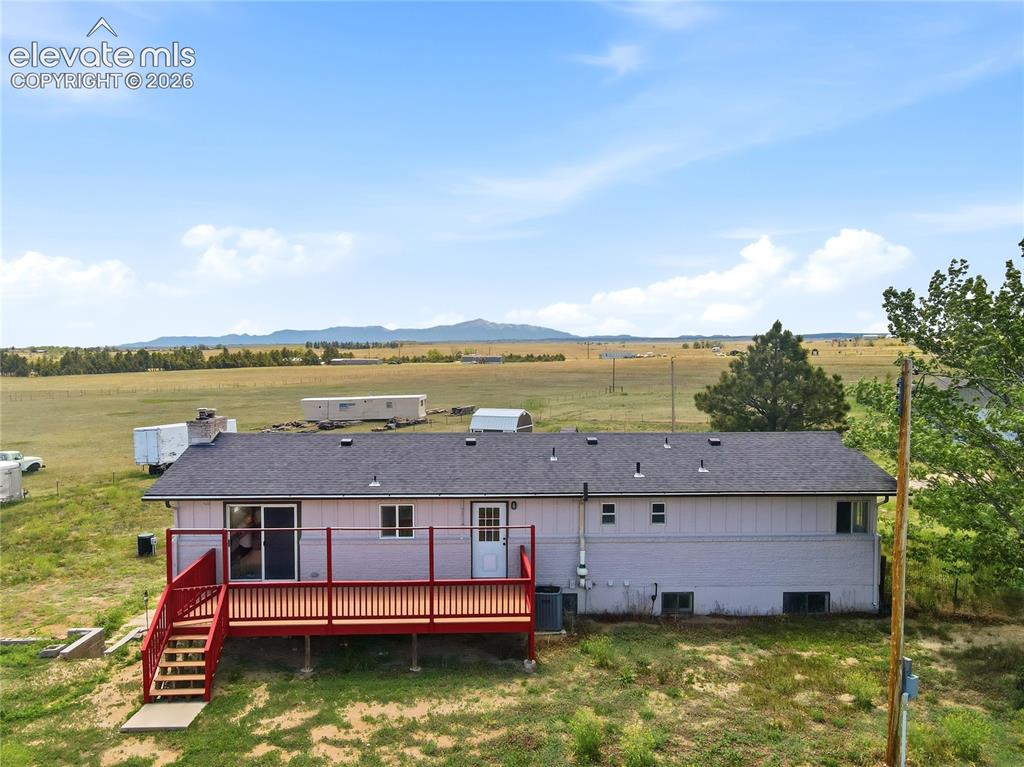19027 Murphy Road Peyton, CO 80831 - Photo 40 of 48 Composite, Deck Set Up For Wind Covering, Slider, Door To Mud Space Off Kitchen