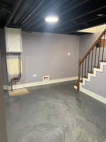 a view of an empty room with stairs