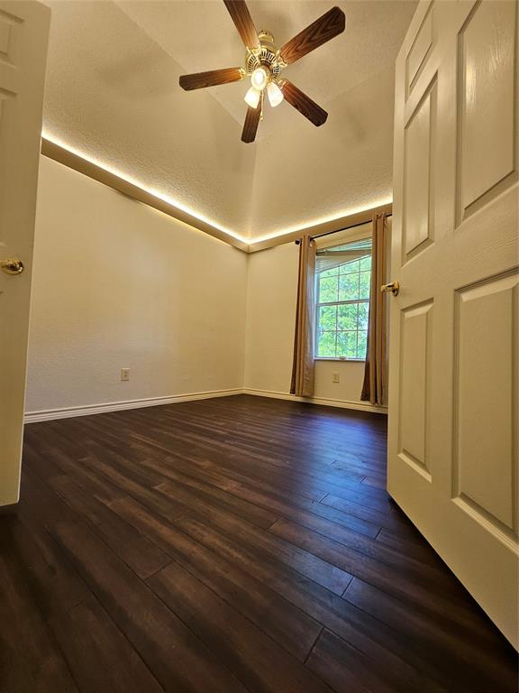 234 East Fork Road Sunnyvale, TX 75182 - Photo 11 of 32 a view of an empty room with wooden floor and a window