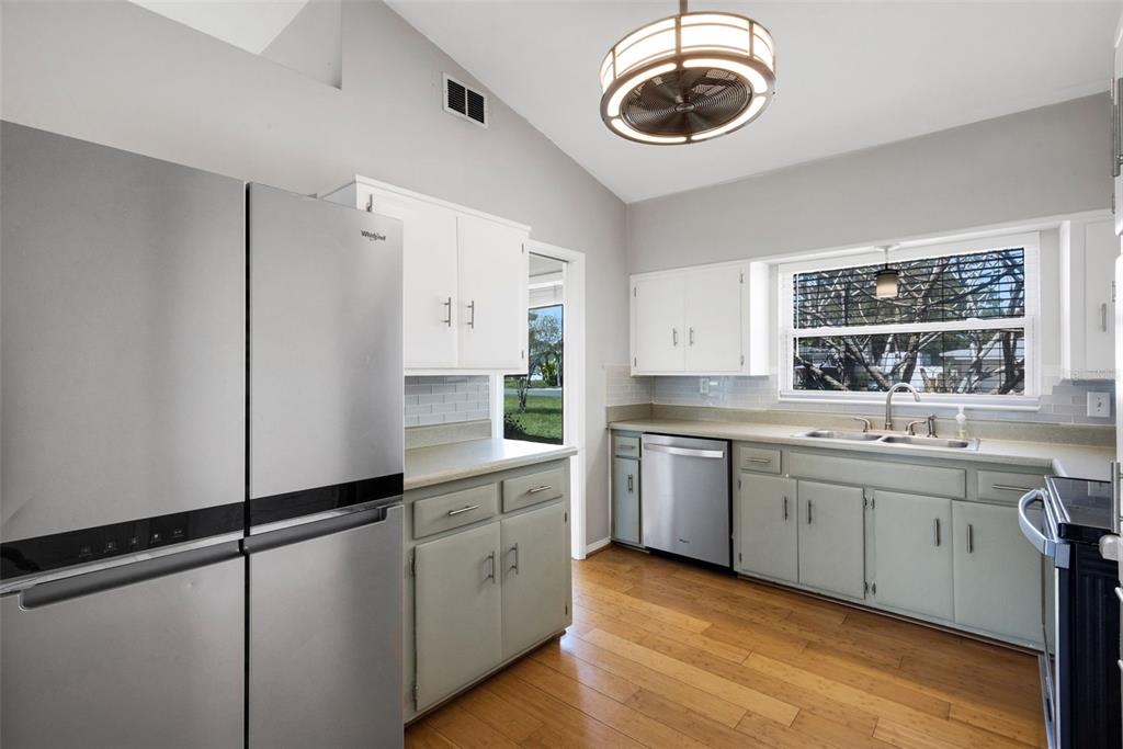 11436 Ridgewood Circle Seminole, FL 33772 - Photo 12 of 38 a kitchen with sink cabinets and window