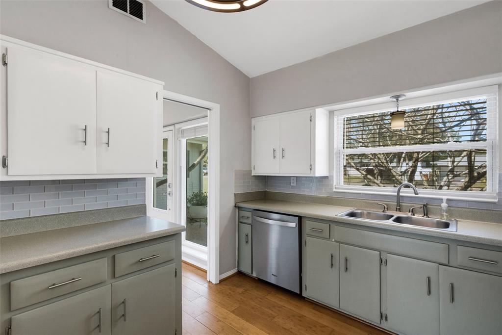 11436 Ridgewood Circle Seminole, FL 33772 - Photo 14 of 38 a kitchen with appliances cabinets and a sink