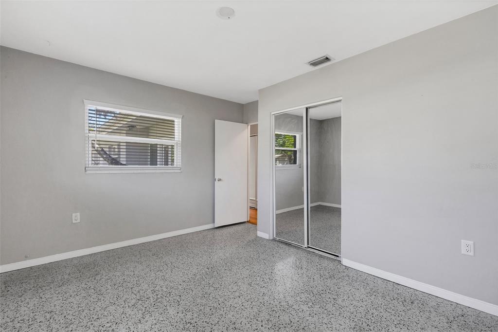 11436 Ridgewood Circle Seminole, FL 33772 - Photo 22 of 38 an empty room with windows