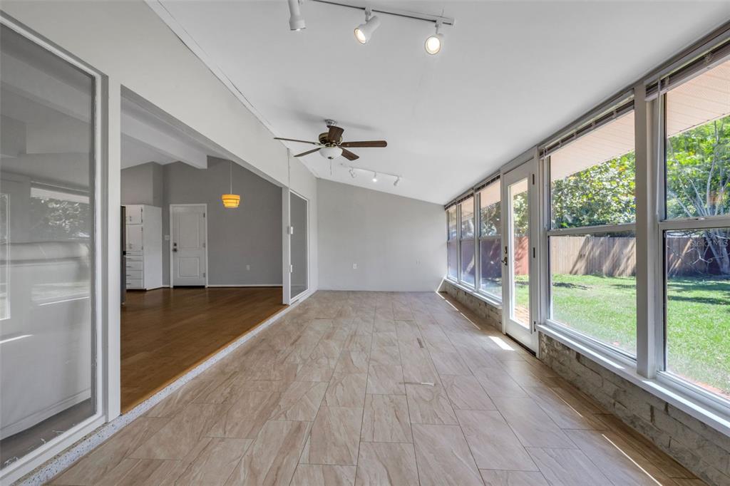 11436 Ridgewood Circle Seminole, FL 33772 - Photo 32 of 38 a view of livingroom with hardwood floor and a ceiling fan