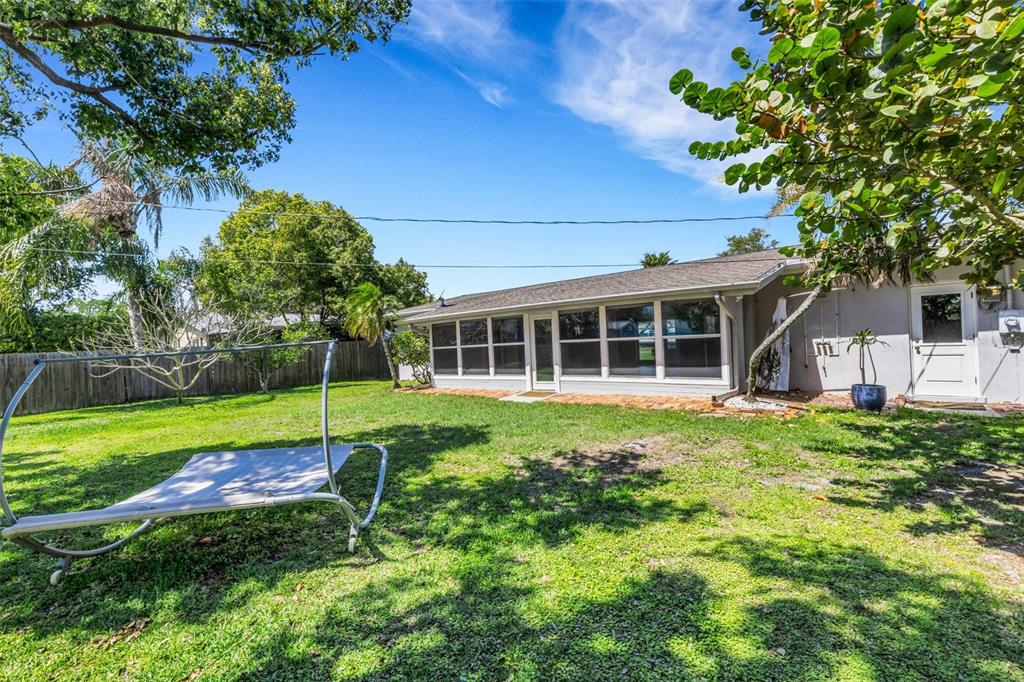 11436 Ridgewood Circle Seminole, FL 33772 - Photo 34 of 38 a view of a house with a backyard