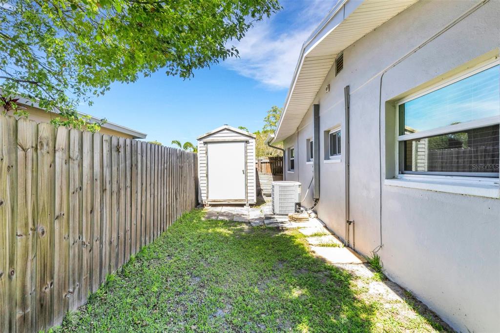 11436 Ridgewood Circle Seminole, FL 33772 - Photo 37 of 38 a view of a house with a yard