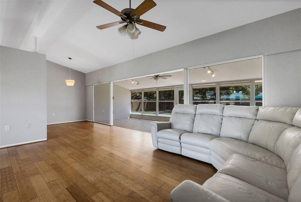 11436 Ridgewood Circle Seminole, FL 33772 - Photo 6 of 38 a living room with furniture and a large window