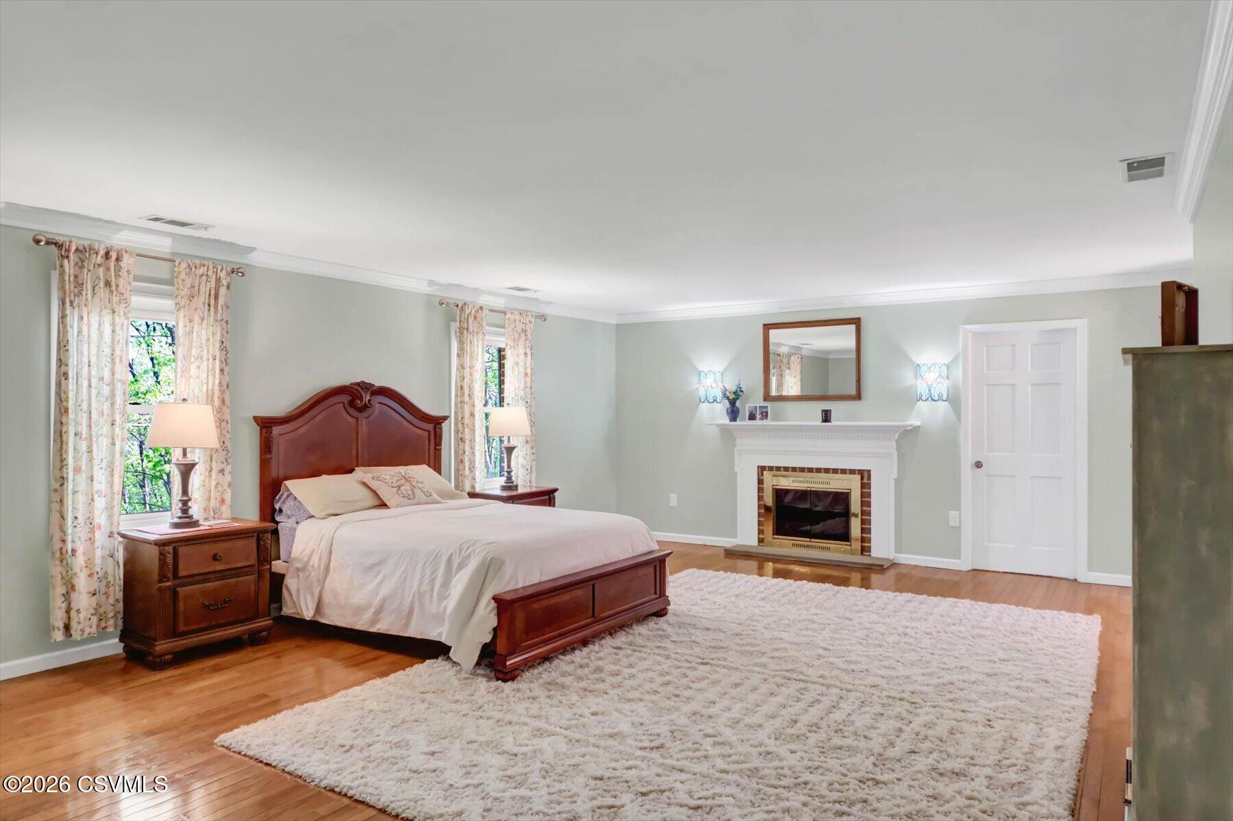 65 Crestview Drive Winfield, PA 17889 - Photo 24 of 70 a bedroom with a bed and a fireplace